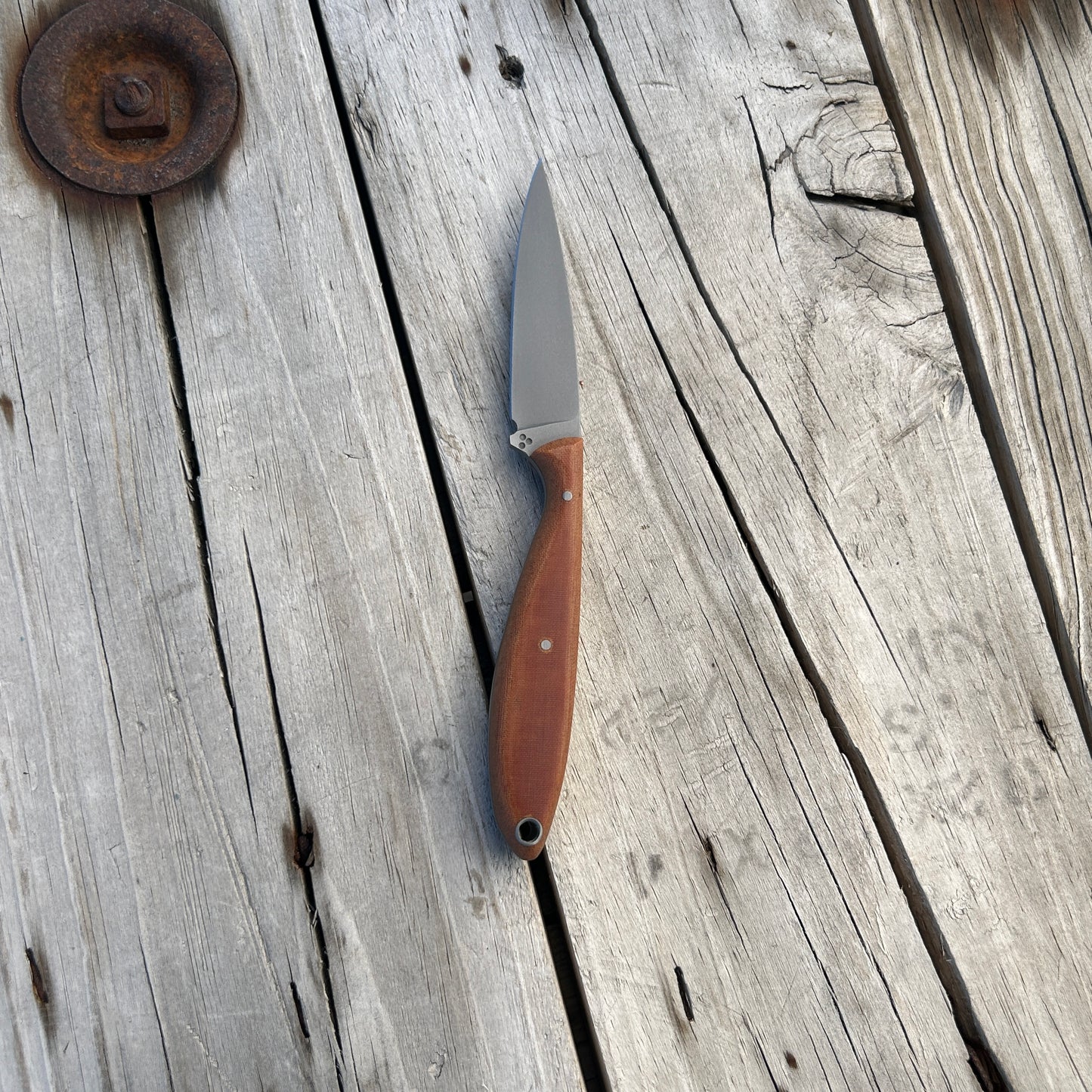 small bird and trout handle with light brown handle