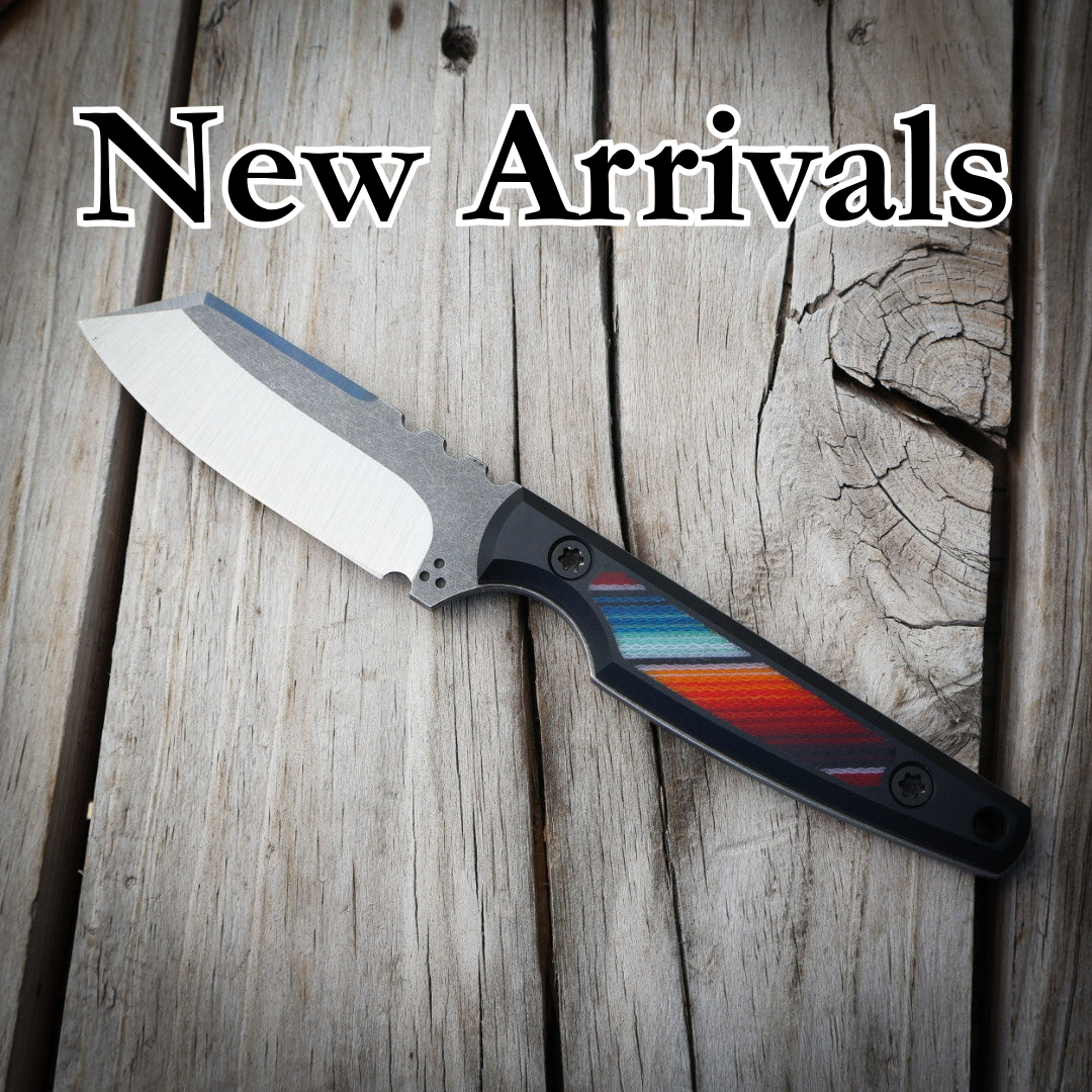 Colorful handle knife sitting on wooden surface with text “New arrivals” 