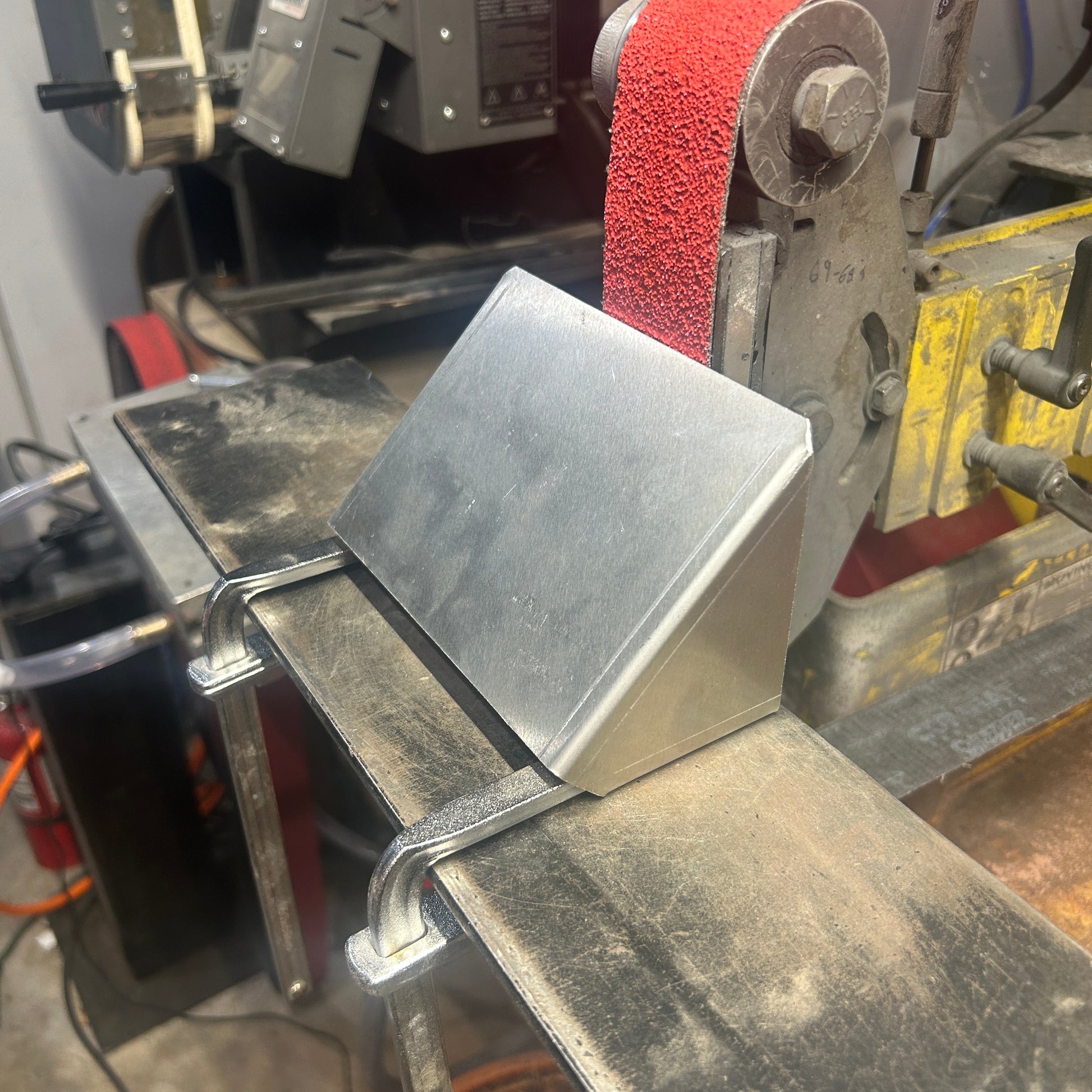 Aluminum chamfer jig clamped to work rest