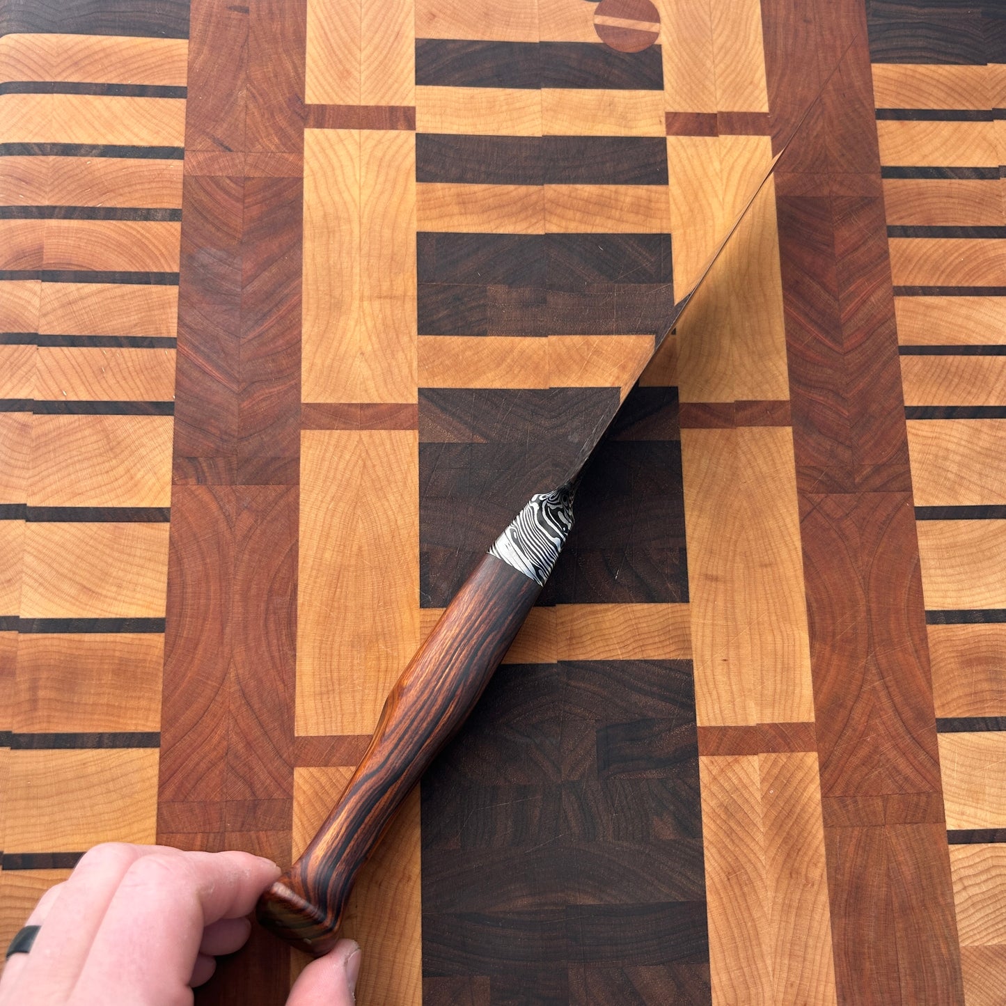 edge down view of Large 14.5 inch damscus kitchen knife with sculpted ironwood handle