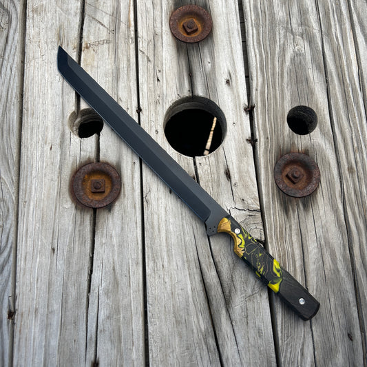 long sword with a detailed handle on a wooden background