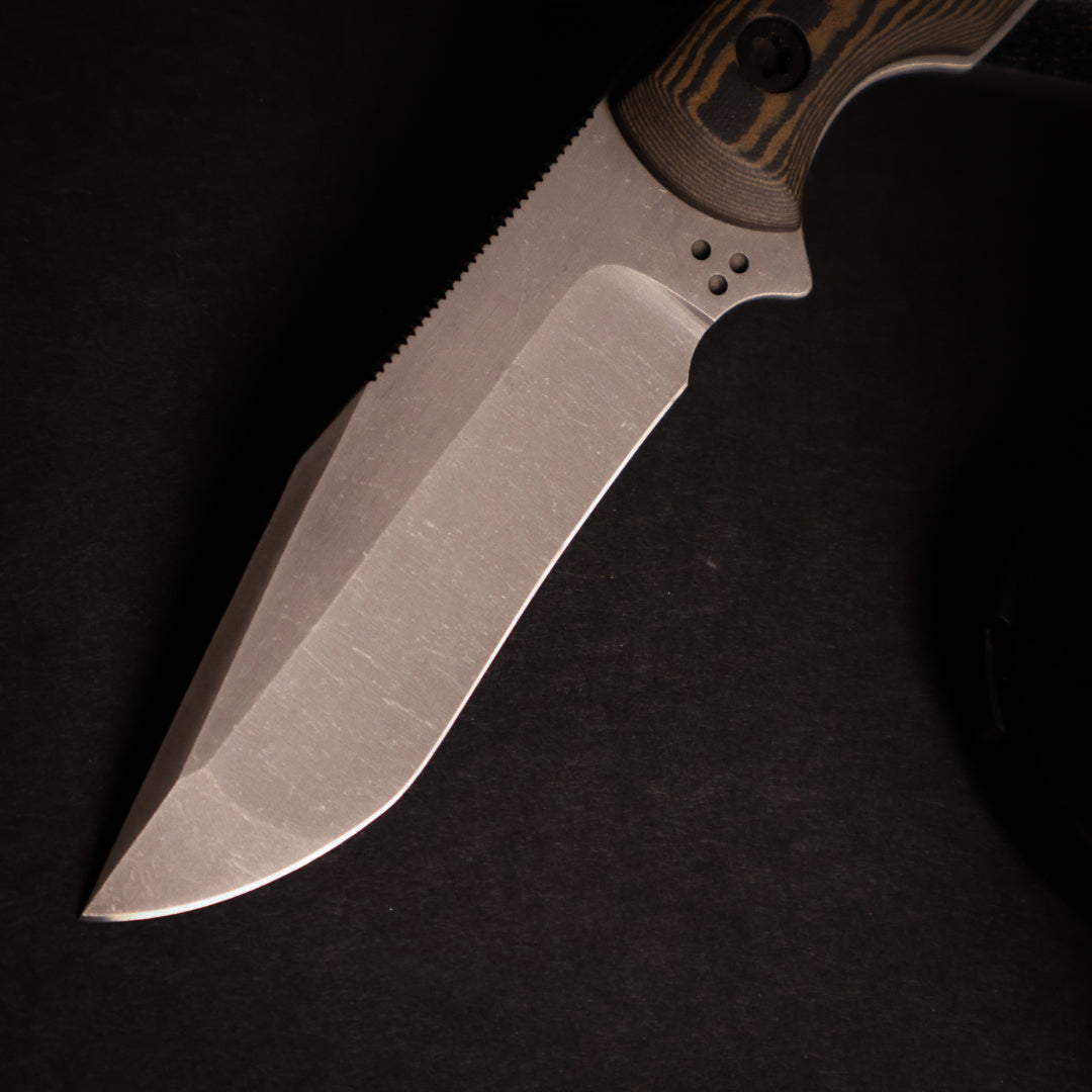 closeup of knife blade with black background. 
