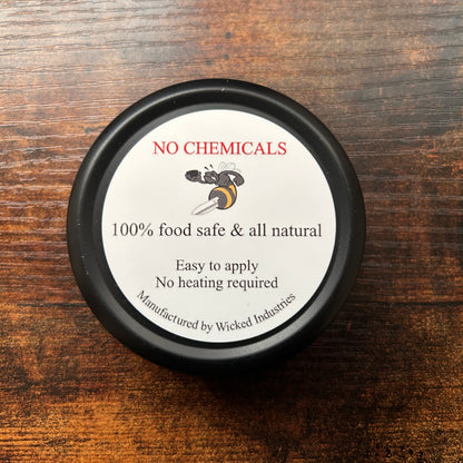 back of a wax can with label reading: No chemicals, 100% food safe & all natural, easy to apply, no heating required, manufactured by Wicked Industries 