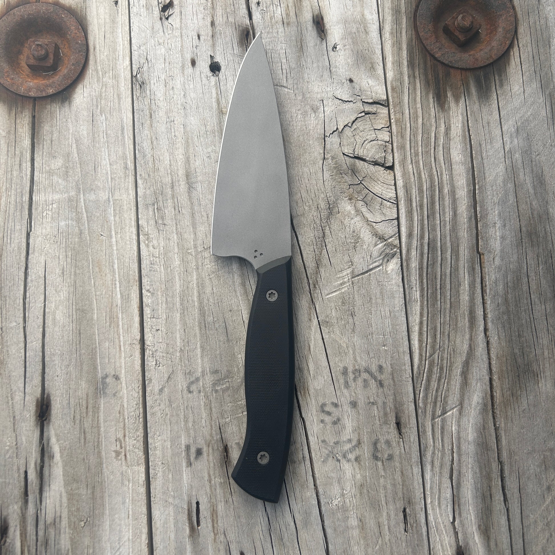 Petty chef knife with black colored handle