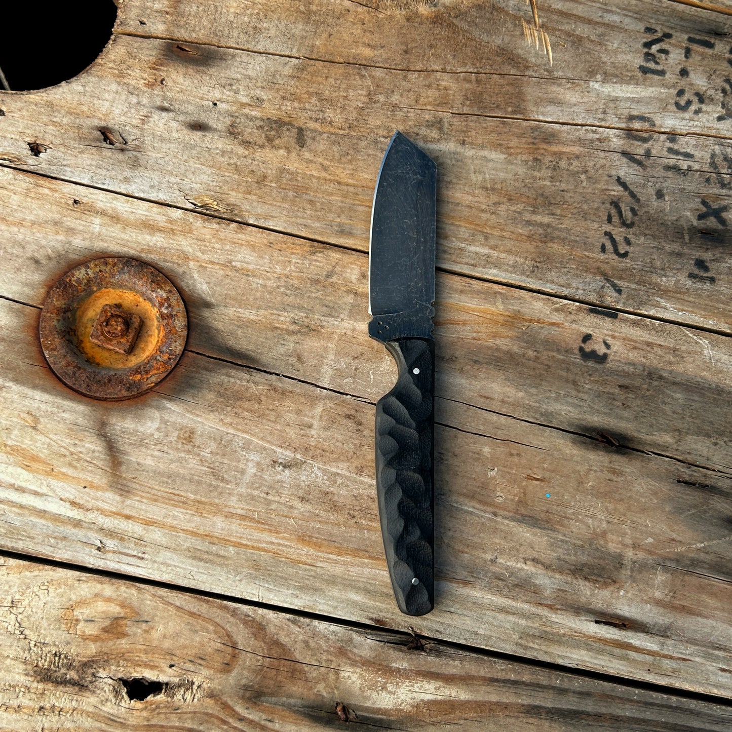 8 inch sheepsfoot style knife with black stonewashed blade & rock textured black G-10 handle