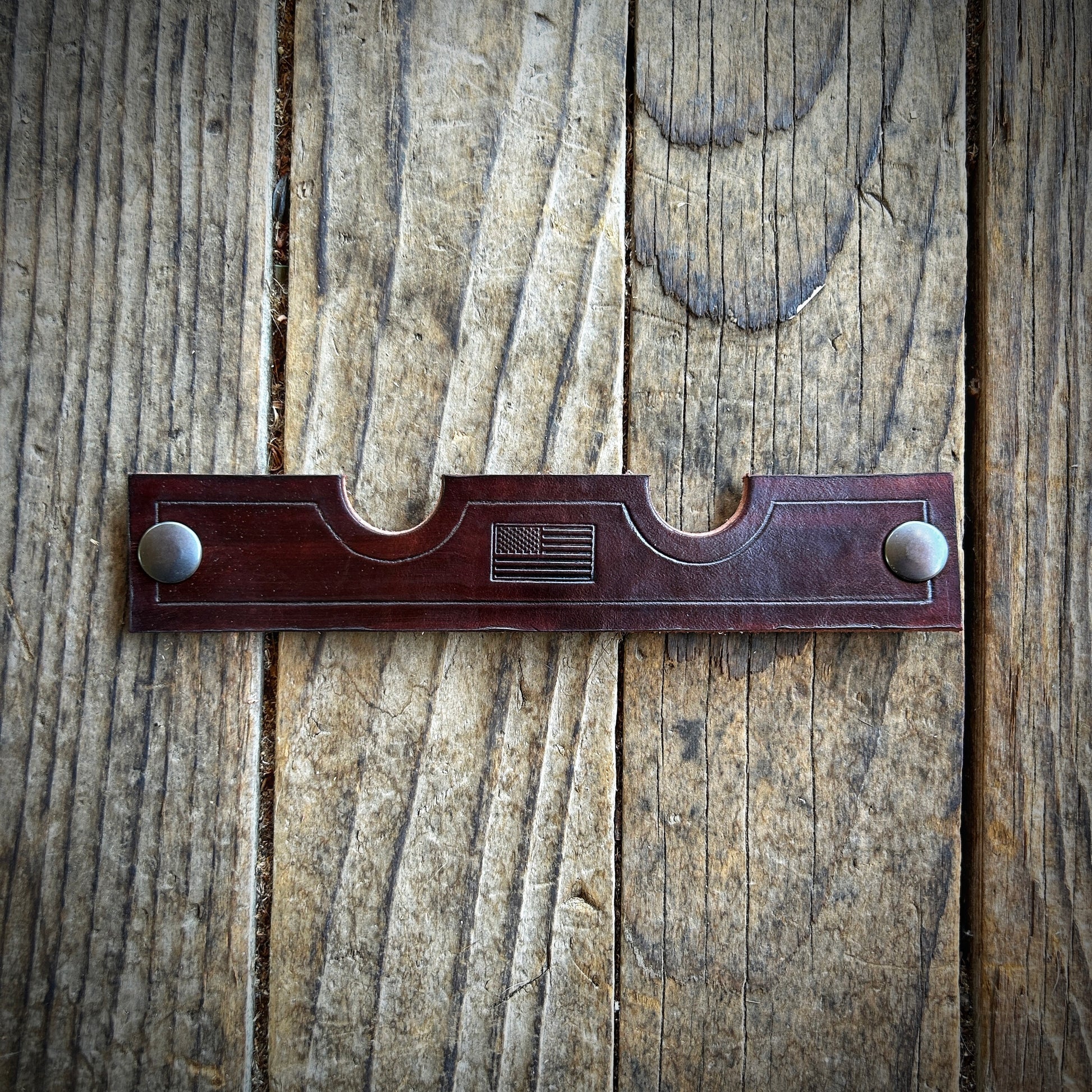 leather cigar & pipe stand unsnapped & laying flat