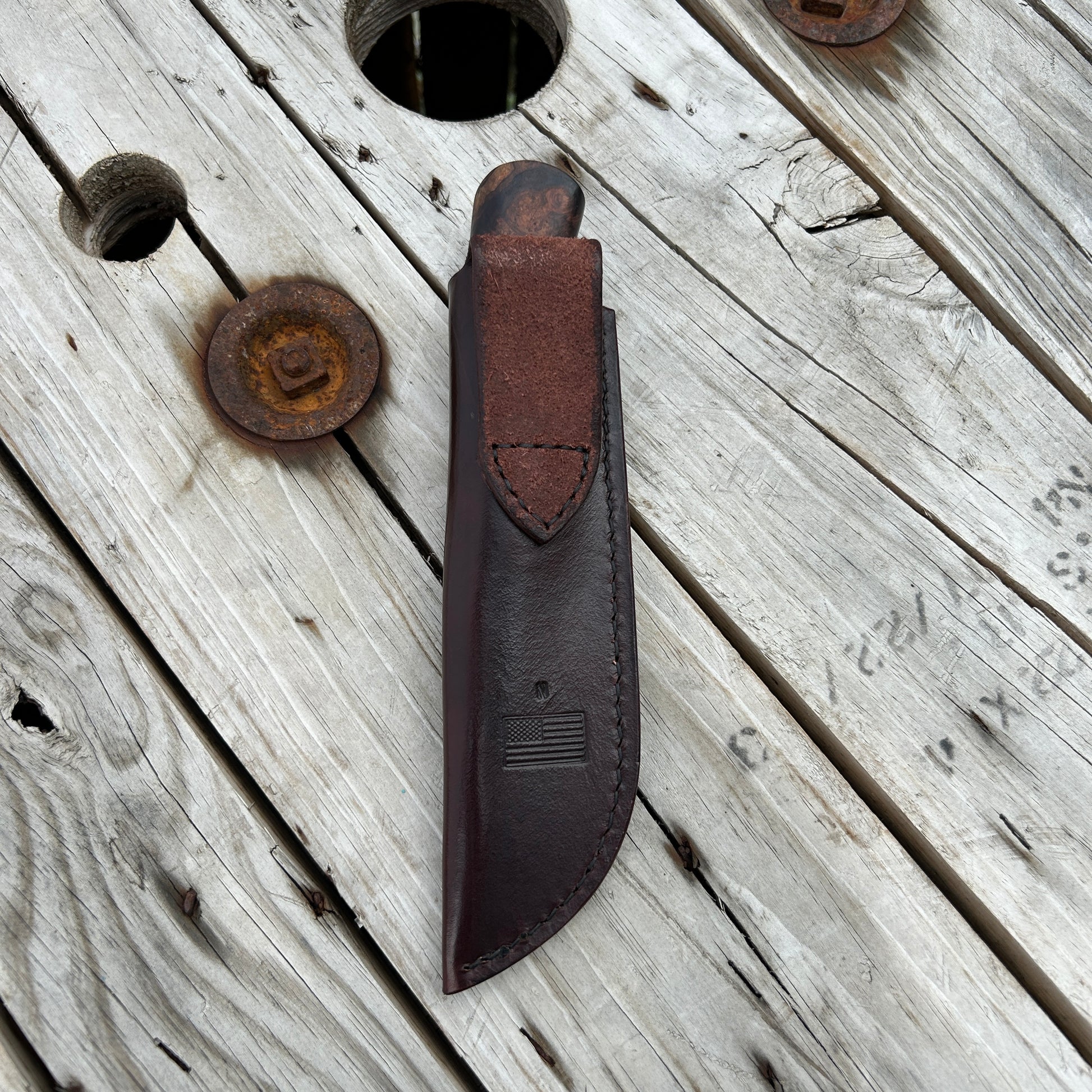 Knife in leather belt sheath 