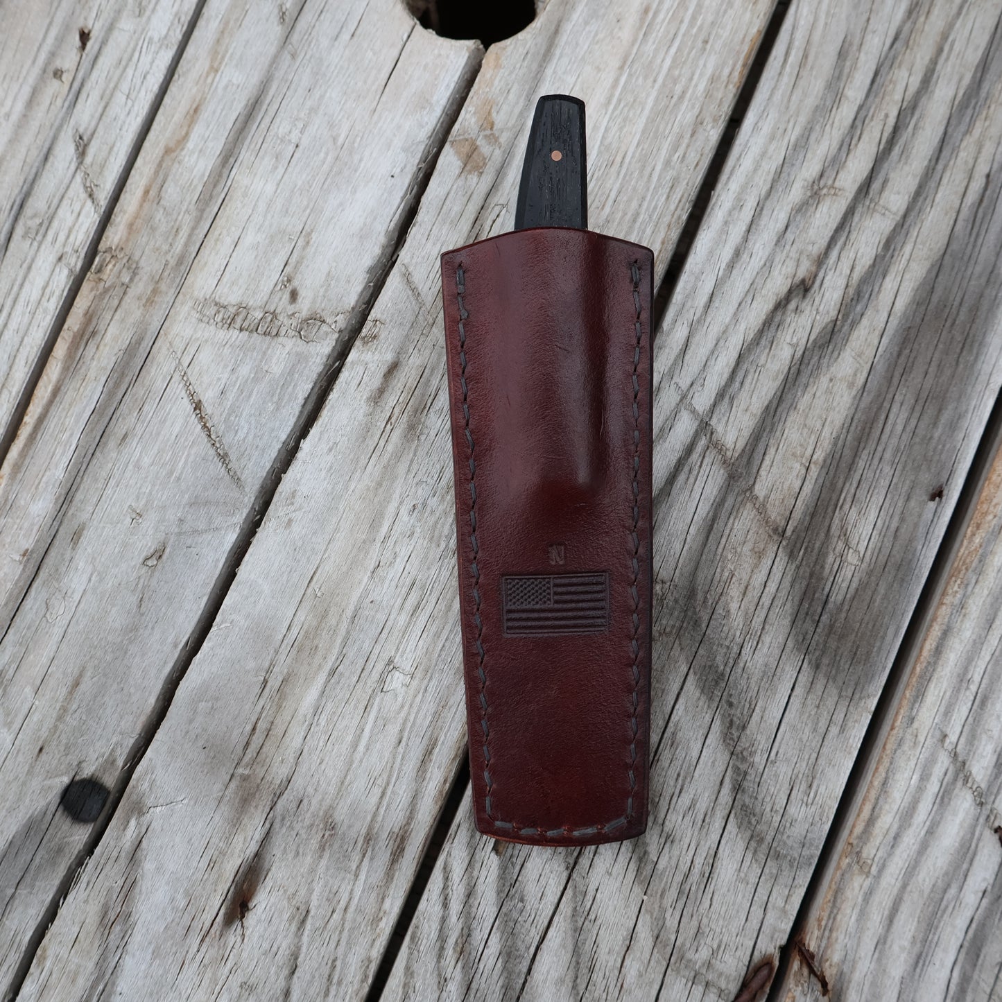 leather pocket sheath with knife in it