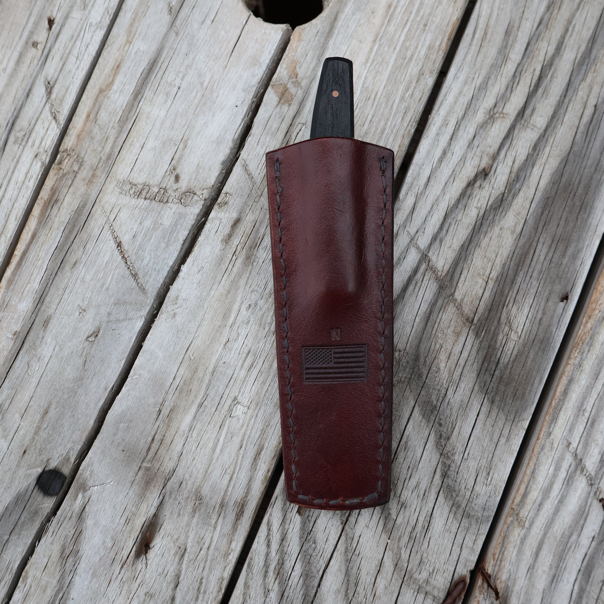 leather pocket sheath with knife in it