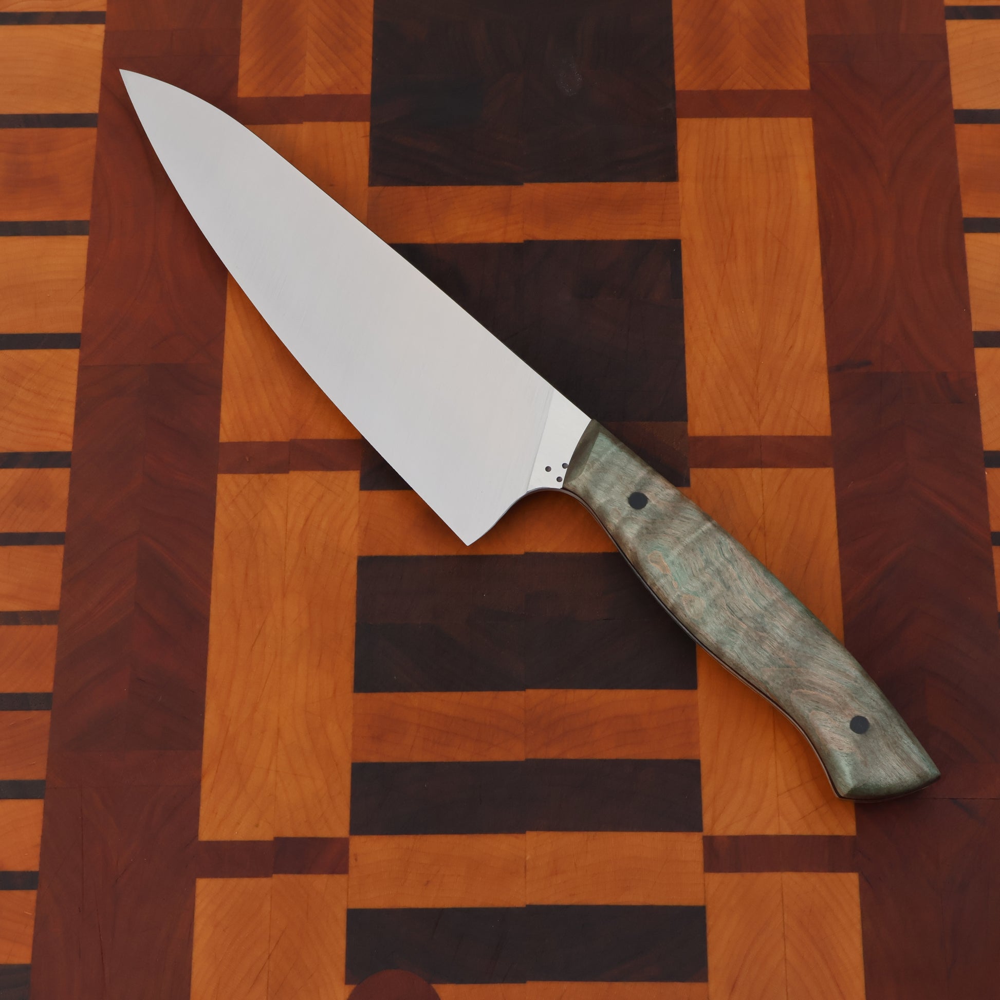 Gyuto styled kitchen knife with wood handle