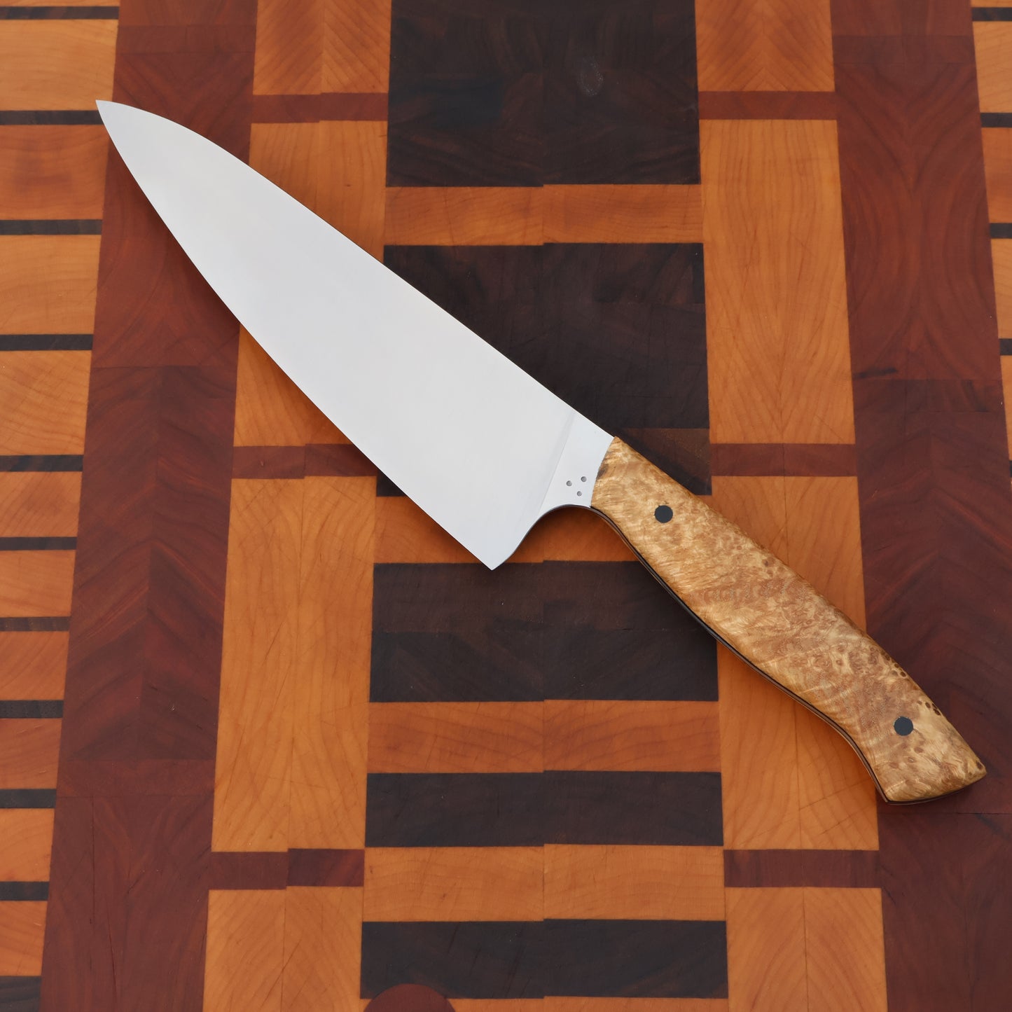 Gyuto styled kitchen knife with wood handle