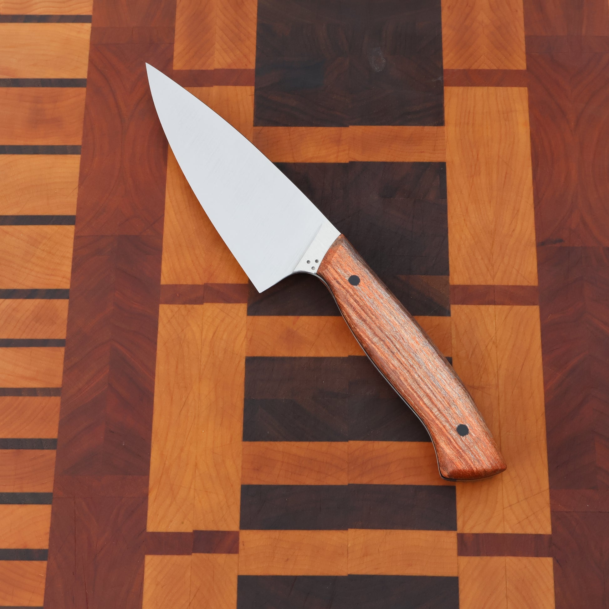 Petty chef kitchen knife with wood handle scales