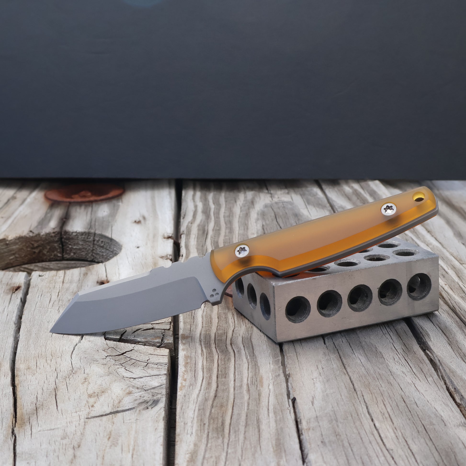 fixed blade knife with ultem (semi-transparent amber colored resign) handle