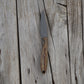 Knife with a light brown handle on a wooden surface