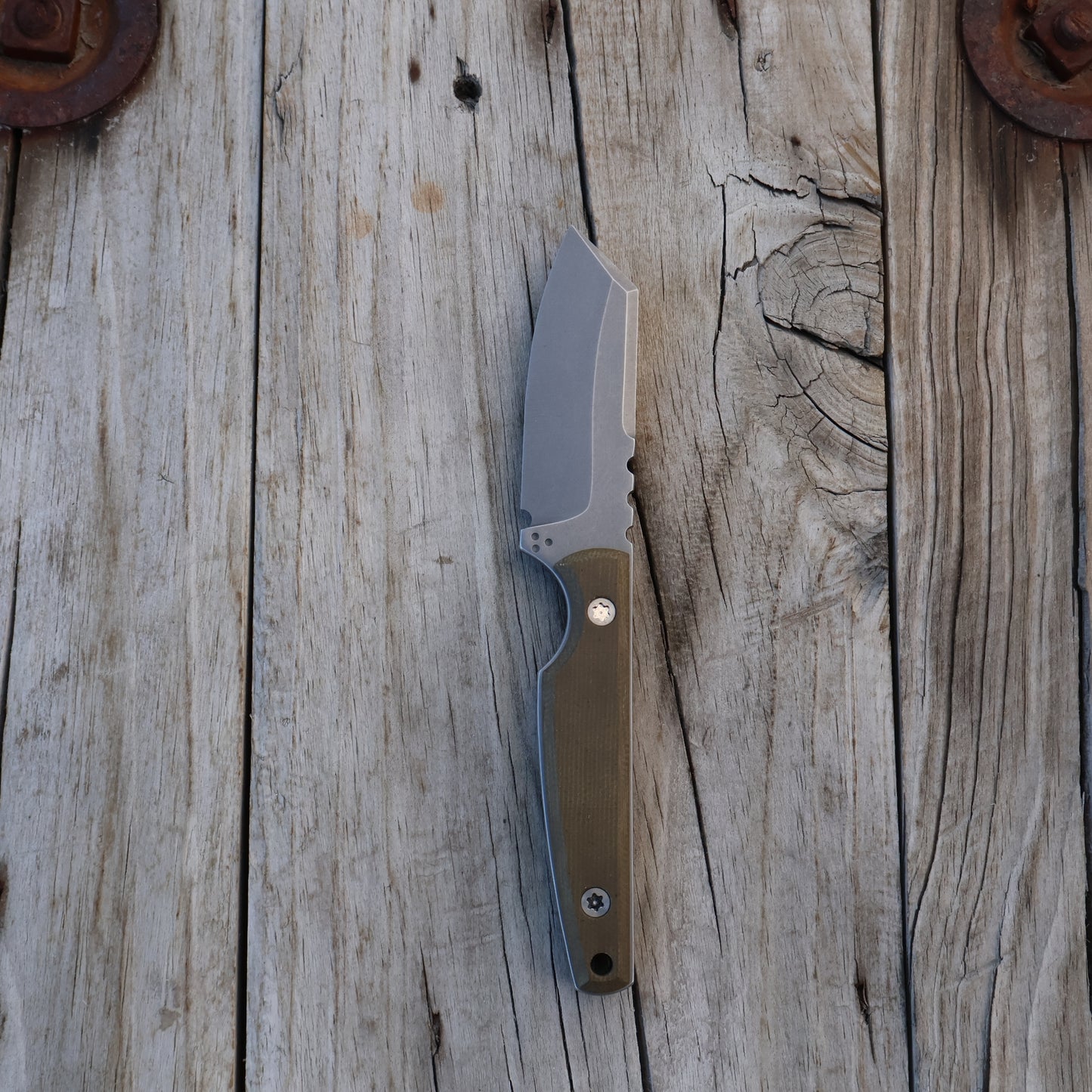 fixed blade knife on a wooden surface