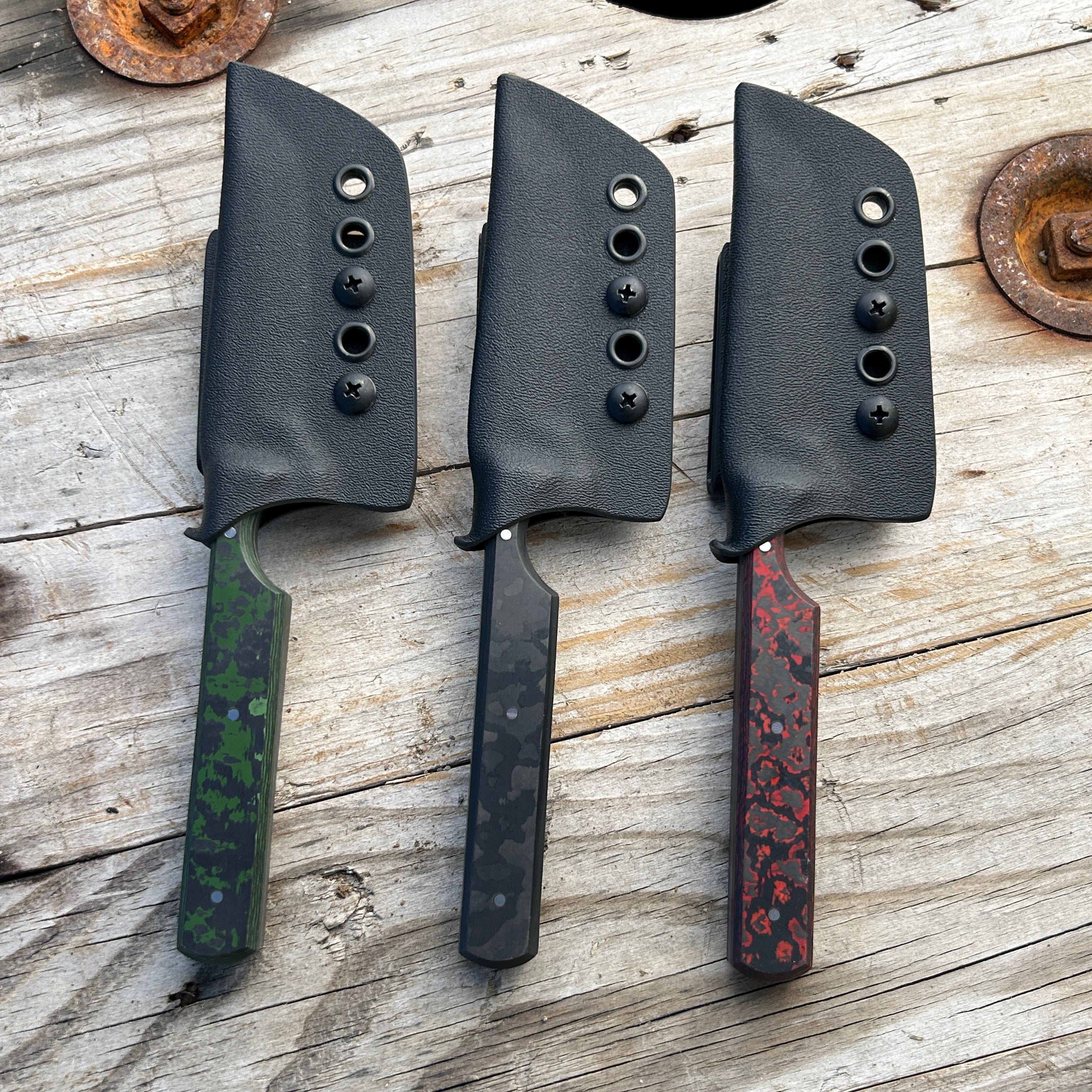 three knives in kydex sheaths 