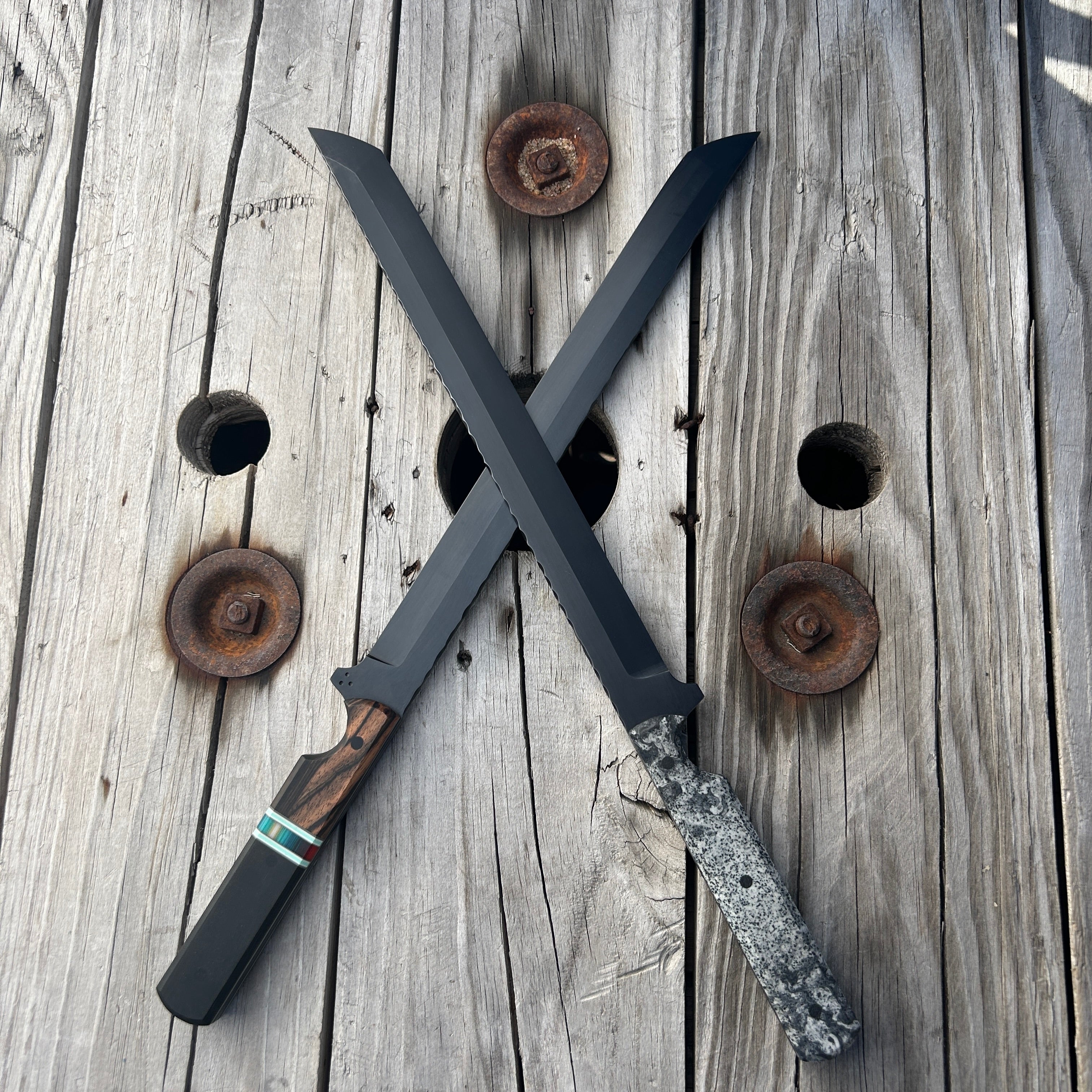Two crossed swords on a wooden surface with rusty nails.