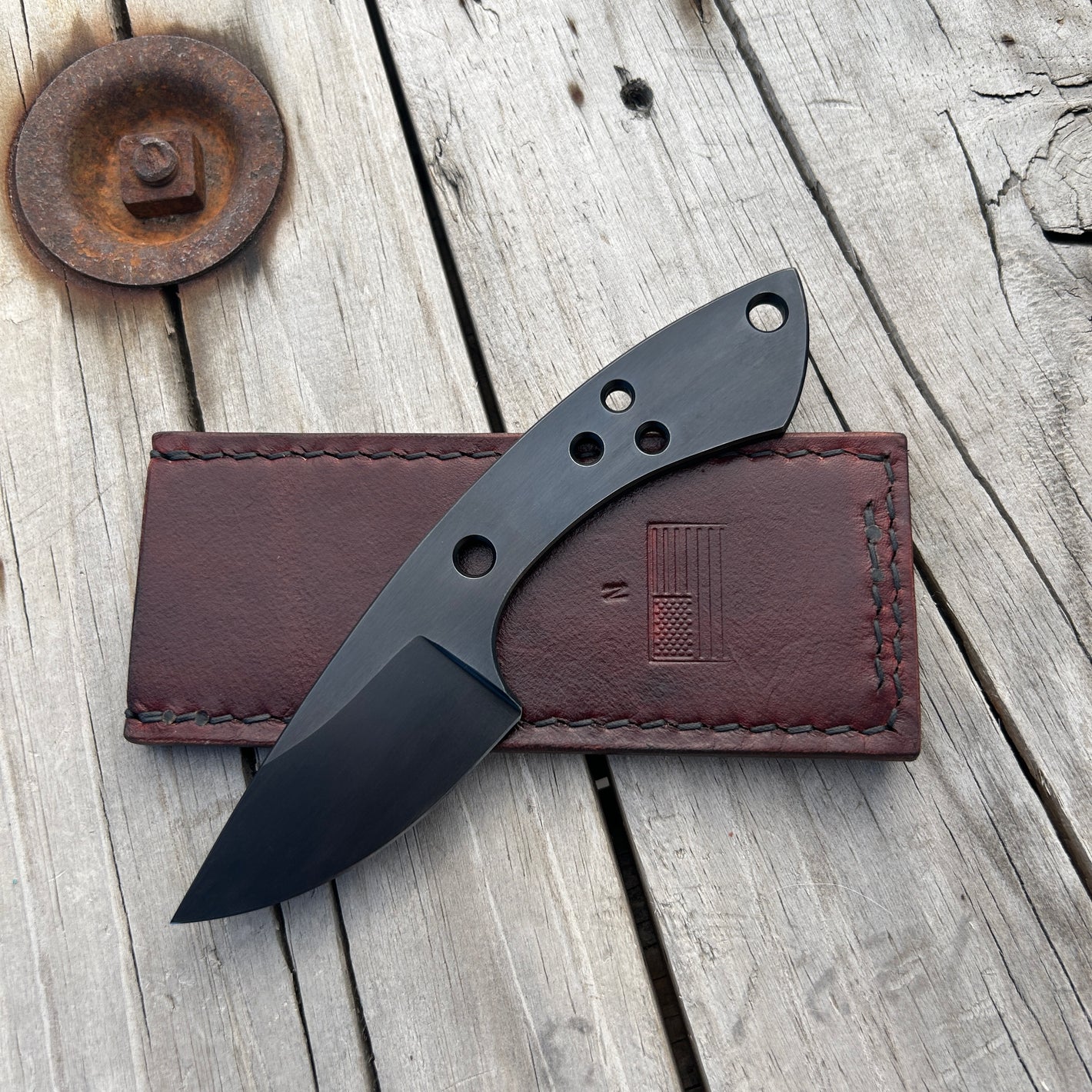 6.3 inch skeletonized pocket knife with black rust blued finish