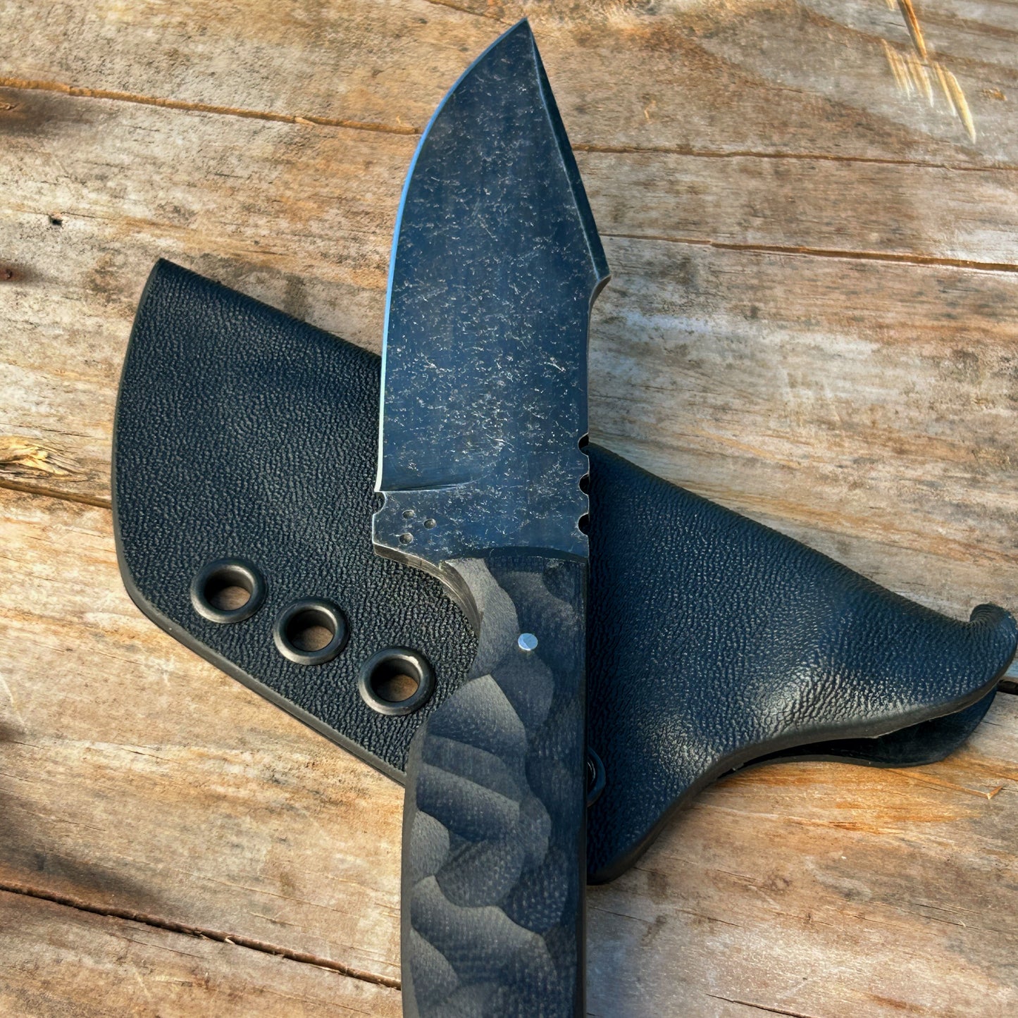 closeup of harpoon knife black stonewashed blade 