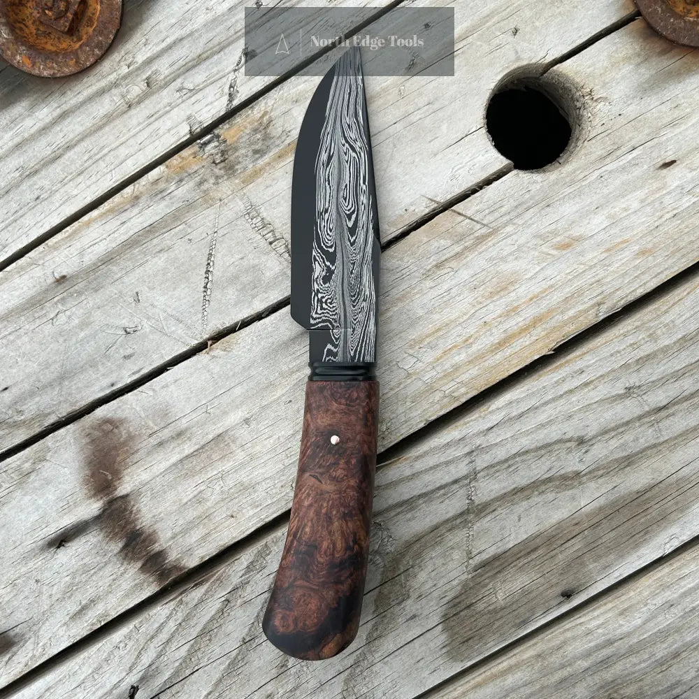 profile view of damascus hunter knife, left side