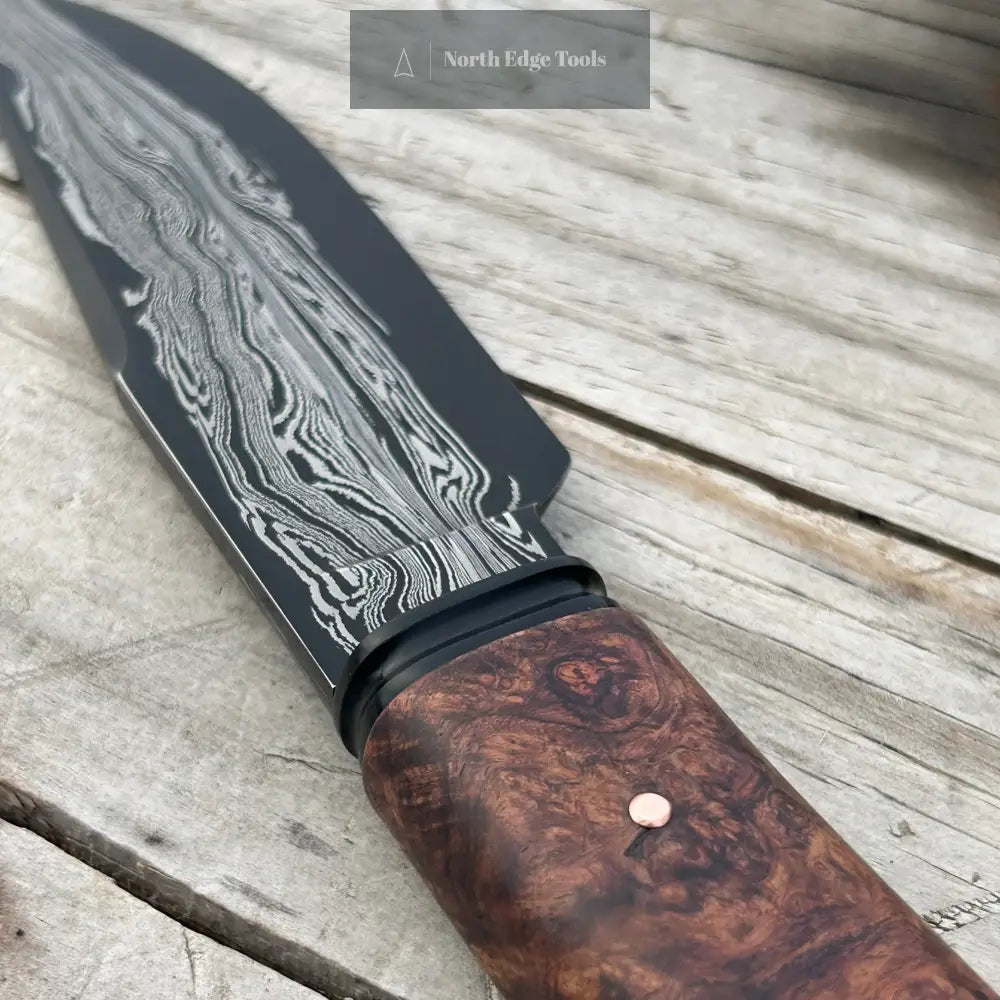 closeup of transition between handle and knife blade
