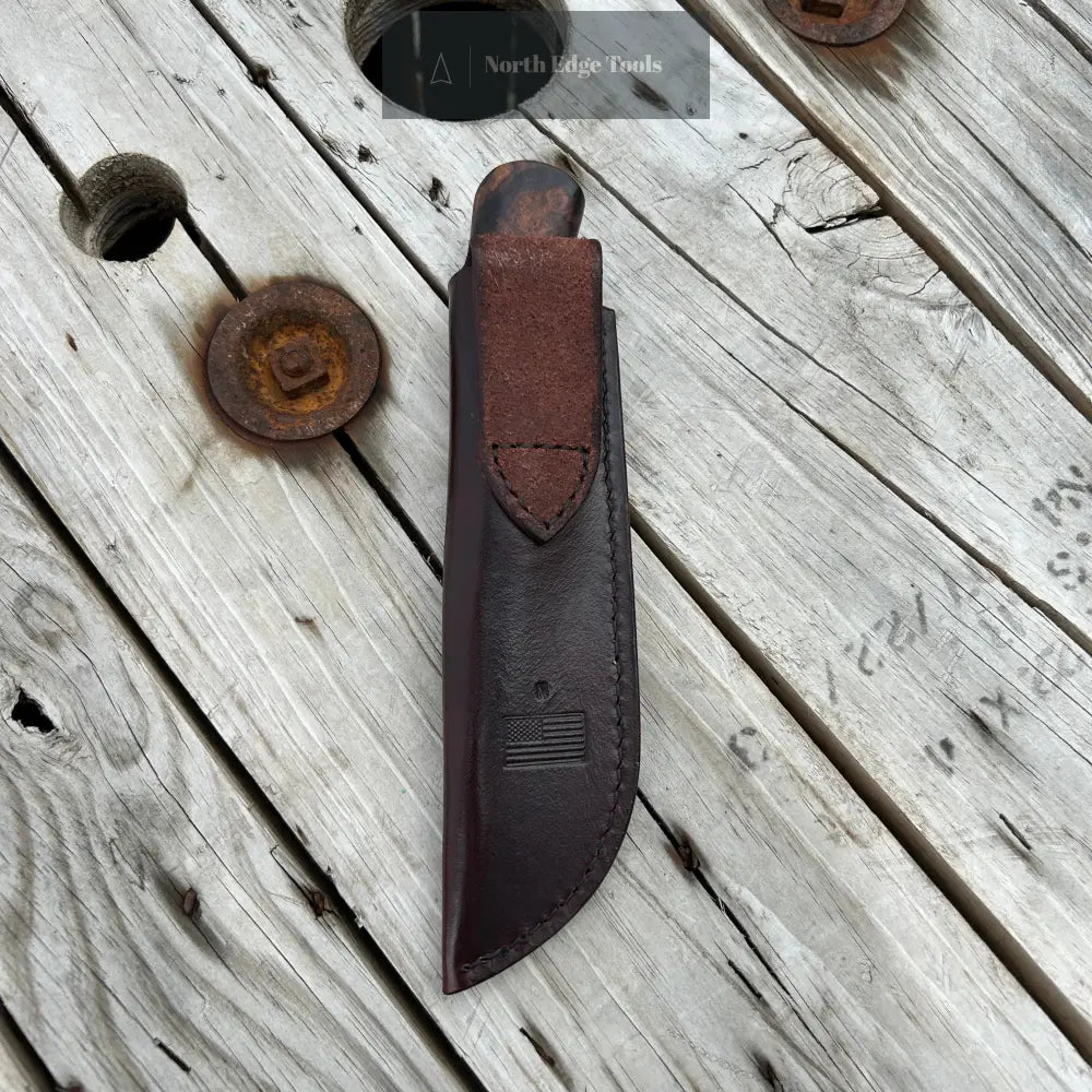 Knife in leather belt sheath 